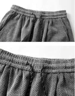 Light grey fleece-lined straight-leg casual trousers with an elastic waistband on a hanger.