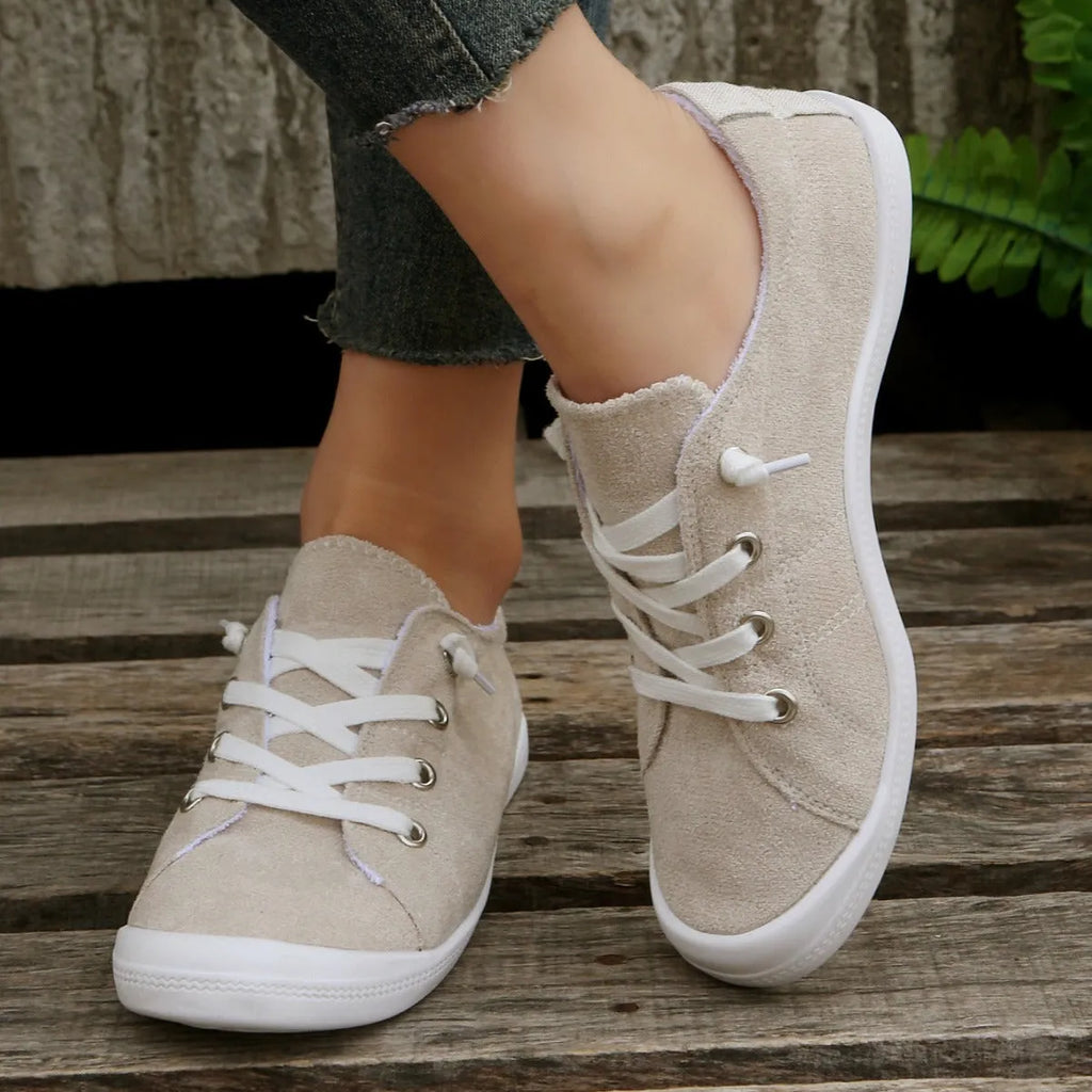 Women's creamy white fabric casual sneakers with rubber sole low top design