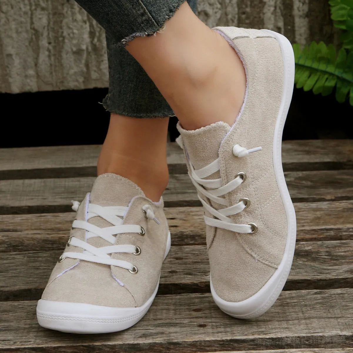 Women's creamy white fabric casual sneakers with rubber sole low top design
