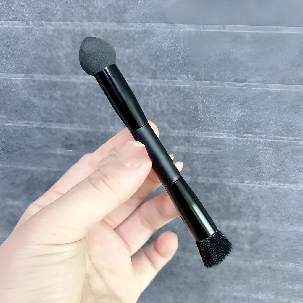 Black wooden-handle concealer brush with triangle sponge tip for dark circles