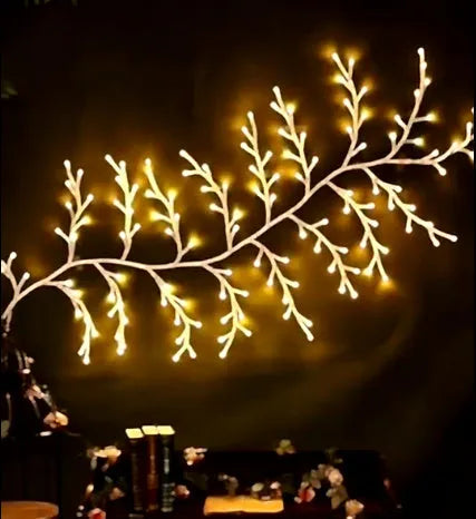 Flexible LED vine Christmas garland with birch bark texture and warm white lights for wall decor