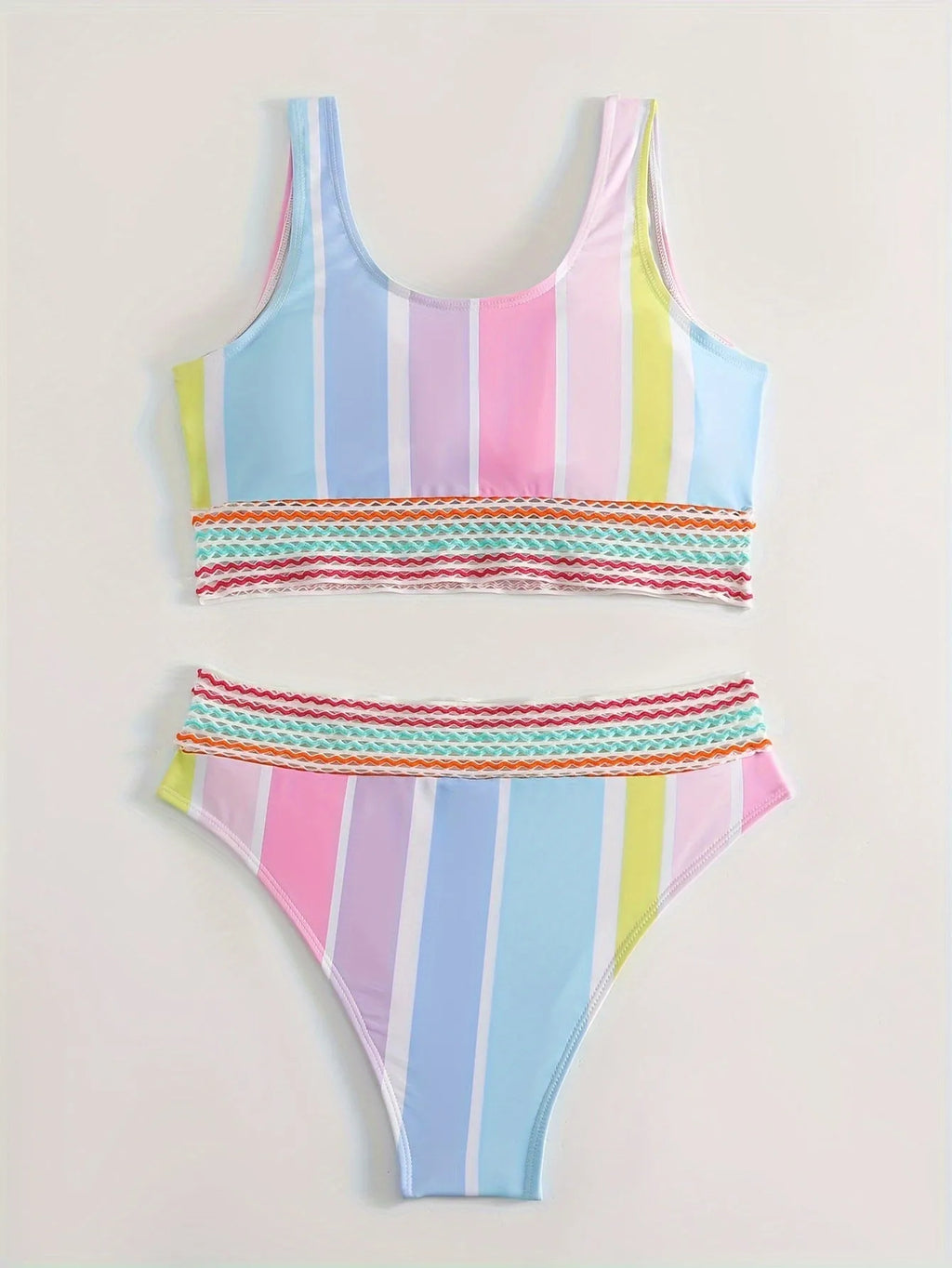 Women's striped sports bikini top and briefs set on a white background