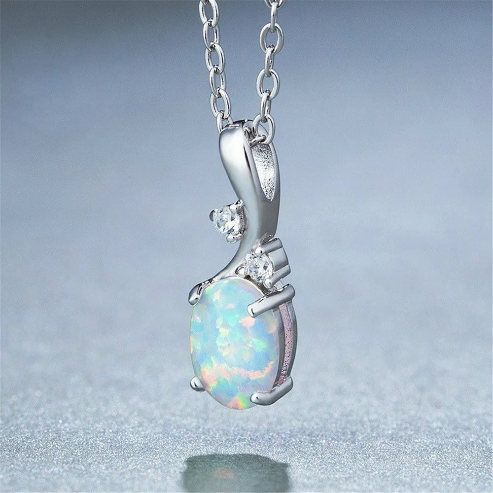 Water drop shaped opal pendant necklace with adjustable chain in white or rose gold finish