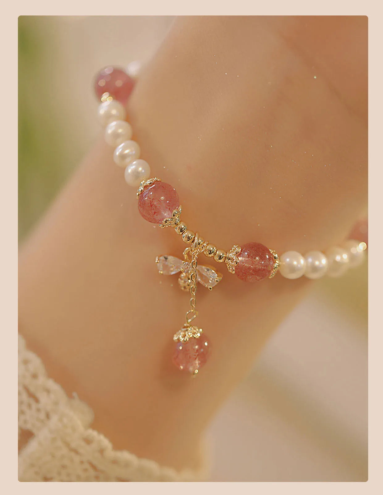 Strawberry quartz colour crystal bracelet with bow and stringed pearls.