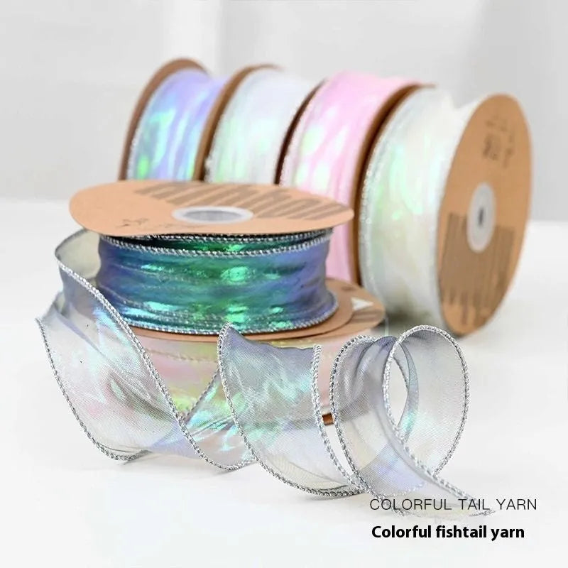 Roll of 4cm wide mesh fishtail yarn craft ribbon in various illusion colours.