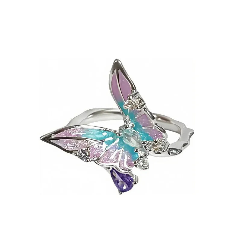 Adjustable copper insect ring with hand-dripped oil finish in silver, pink, or blue colour variations