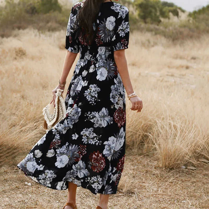 Women's floral print beach dress with V-neck, short sleeves, elastic waist, and mid-length skirt.