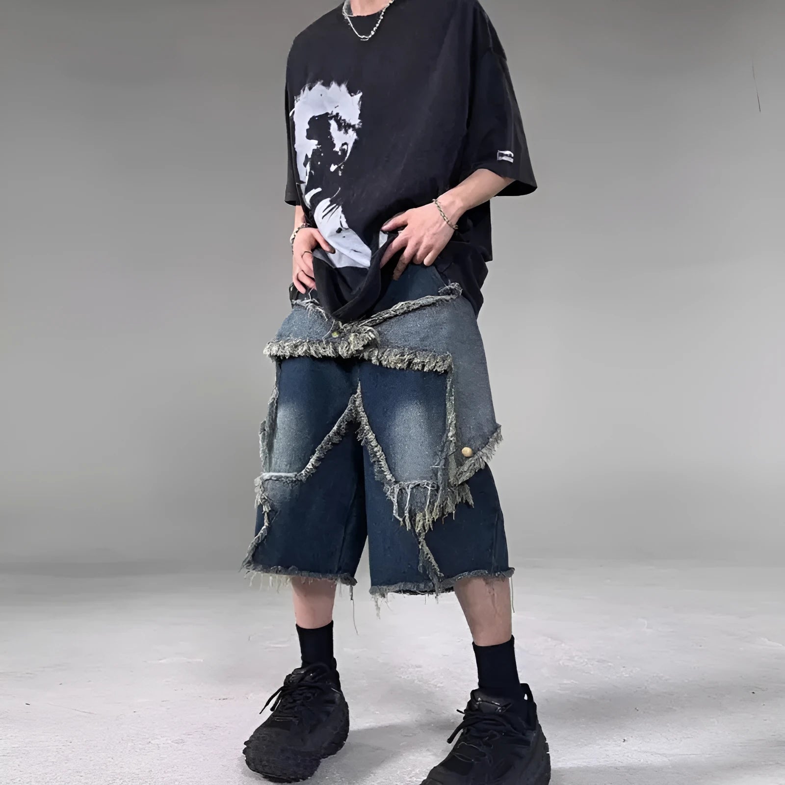 Men's blue retro denim shorts with frayed hem and five-pointed star design, loose fit with knee-length styling