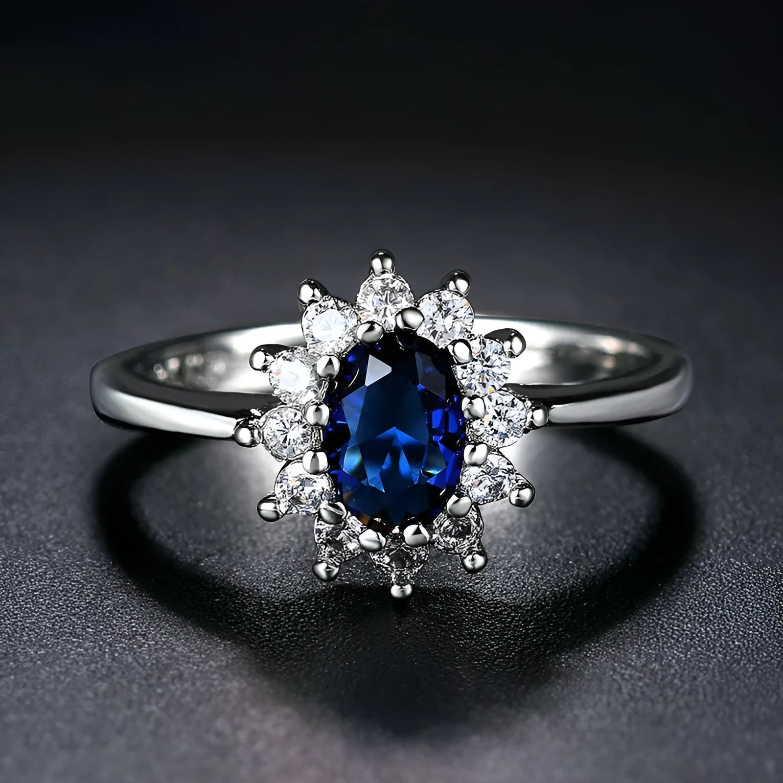 Women's electroplated copper ring with a blue zirconium flower stone on a finger.