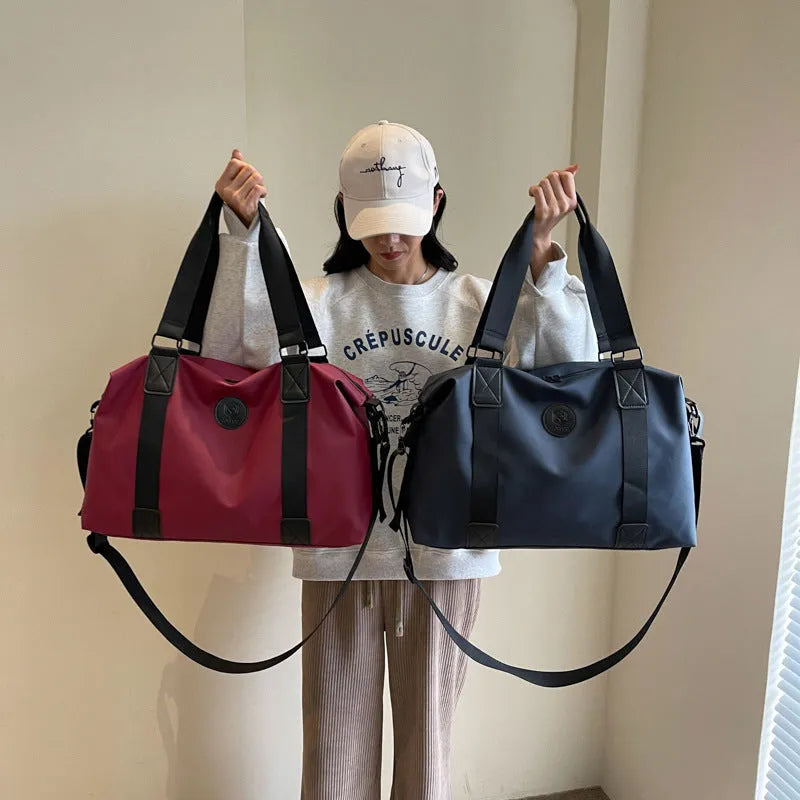 Waterproof Oxford cloth travel bag in solid colour with breathable back panel and 36-55L capacity