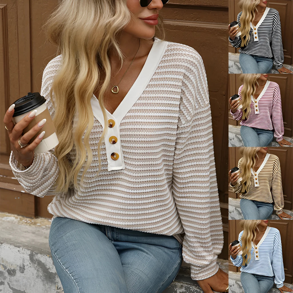 Women's loose-fitting apricot V-neck pullover top with button detail and patchwork design on long sleeves.