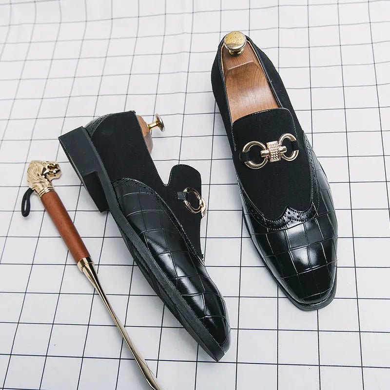 Men's black pointed-toe casual shoes with low-top design and sewn detailing on a rubber sole.
