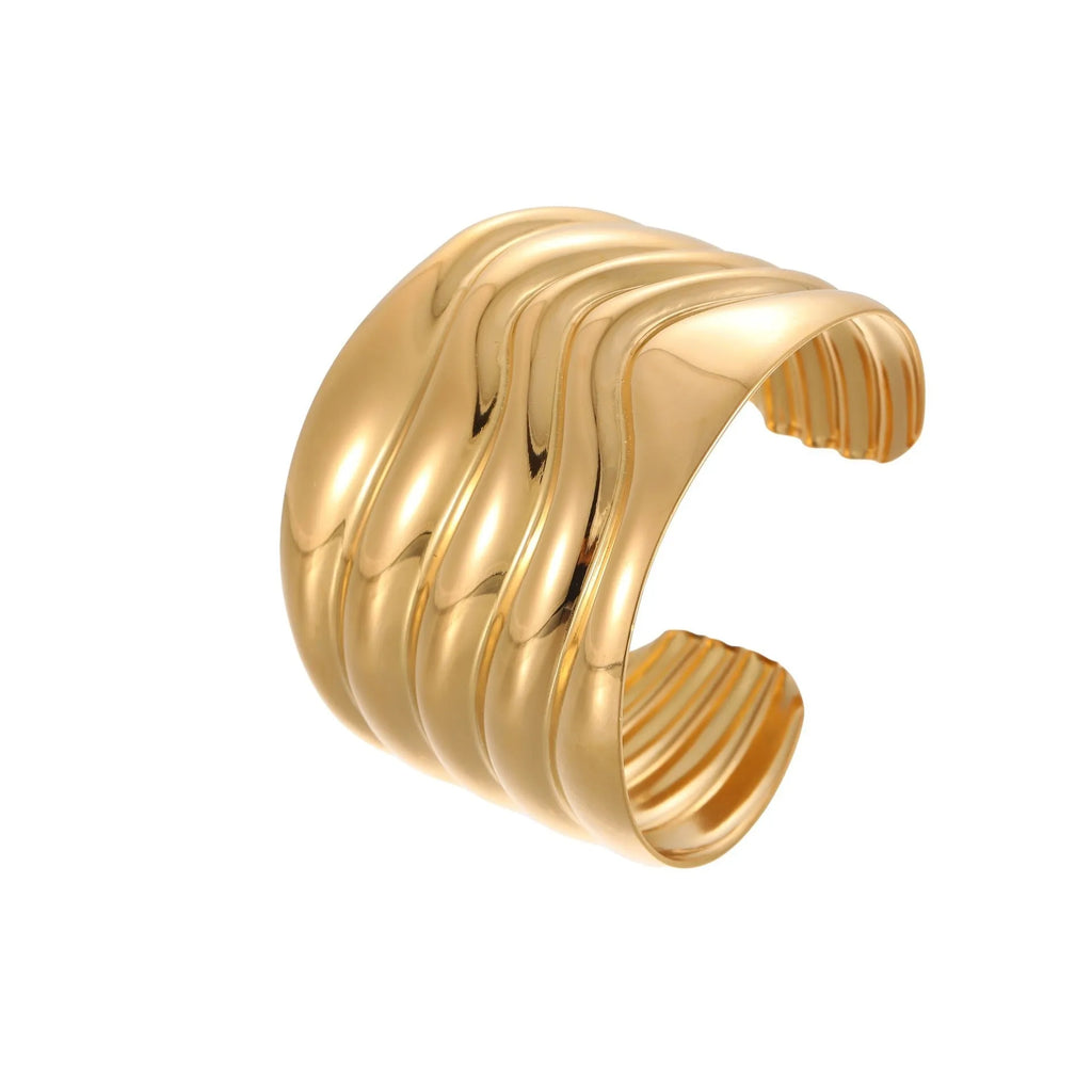 Women's wide fashion bracelet with gold plating and geometric wave design