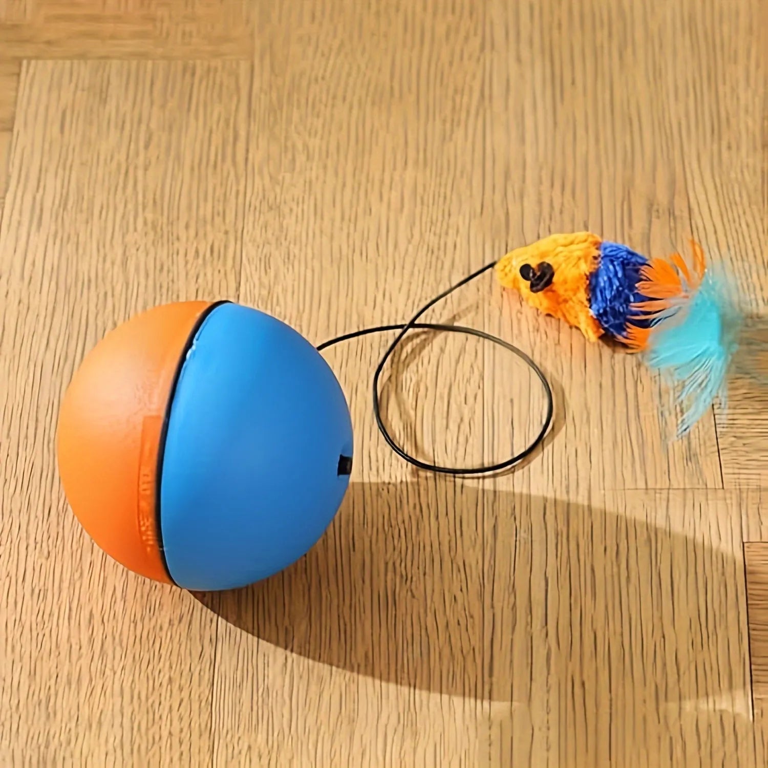 Blue and orange interactive cat toy ball with plush mouse attachment for indoor feline exercise