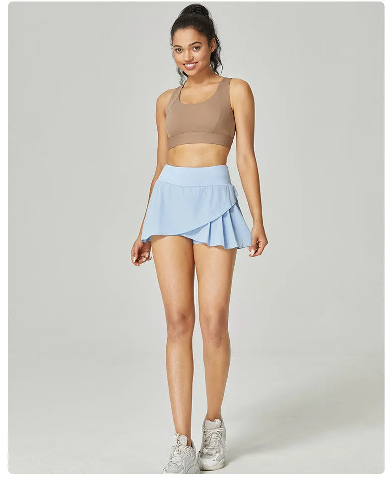 Women's solid colour quick-drying sports shorts in light blue on a mannequin, showing waist-length pullover design.