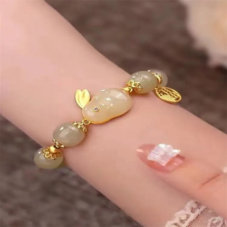 Women's green fu jade hare bracelet with black cord and lily motifs