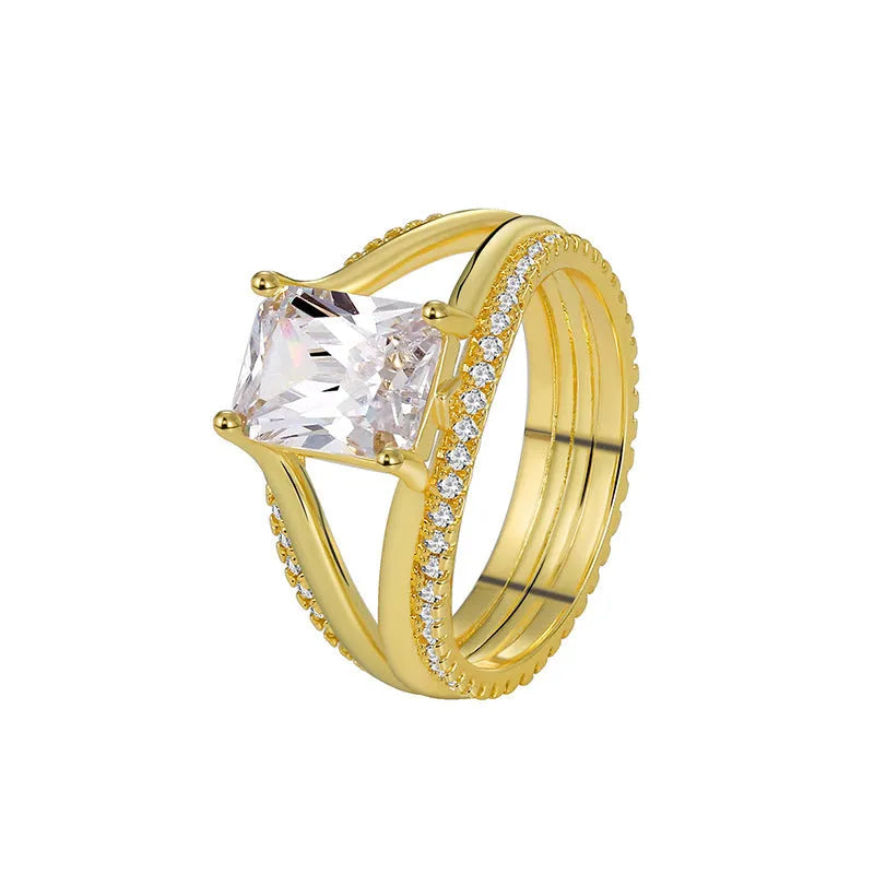 Geometric gold-coloured women's ring with a square zircon stone, shown in size options 6 to 9.