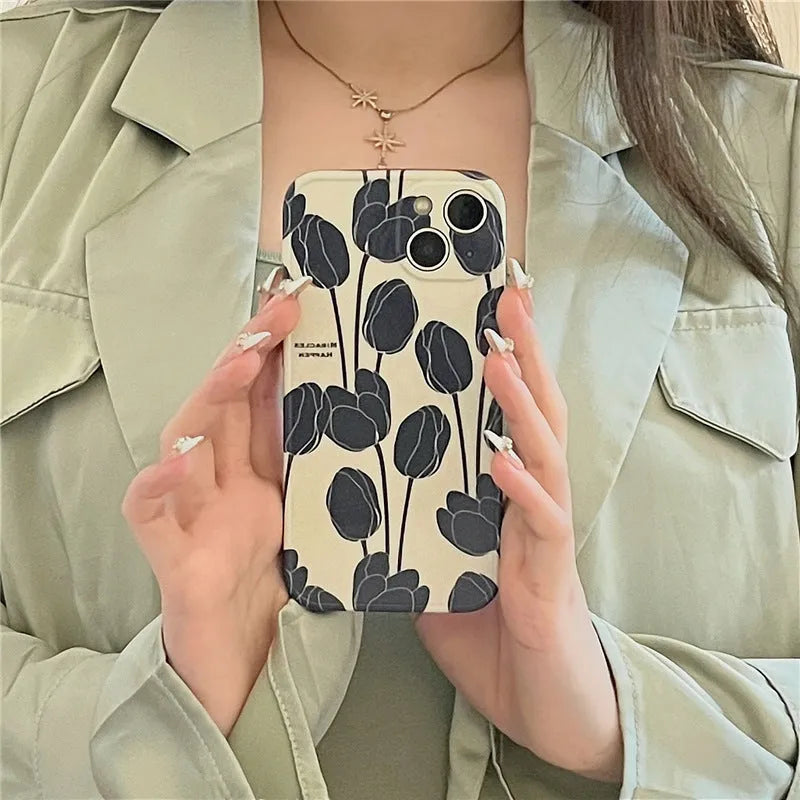 Black tulip patterned silicone phone case for Apple iPhone models on white background