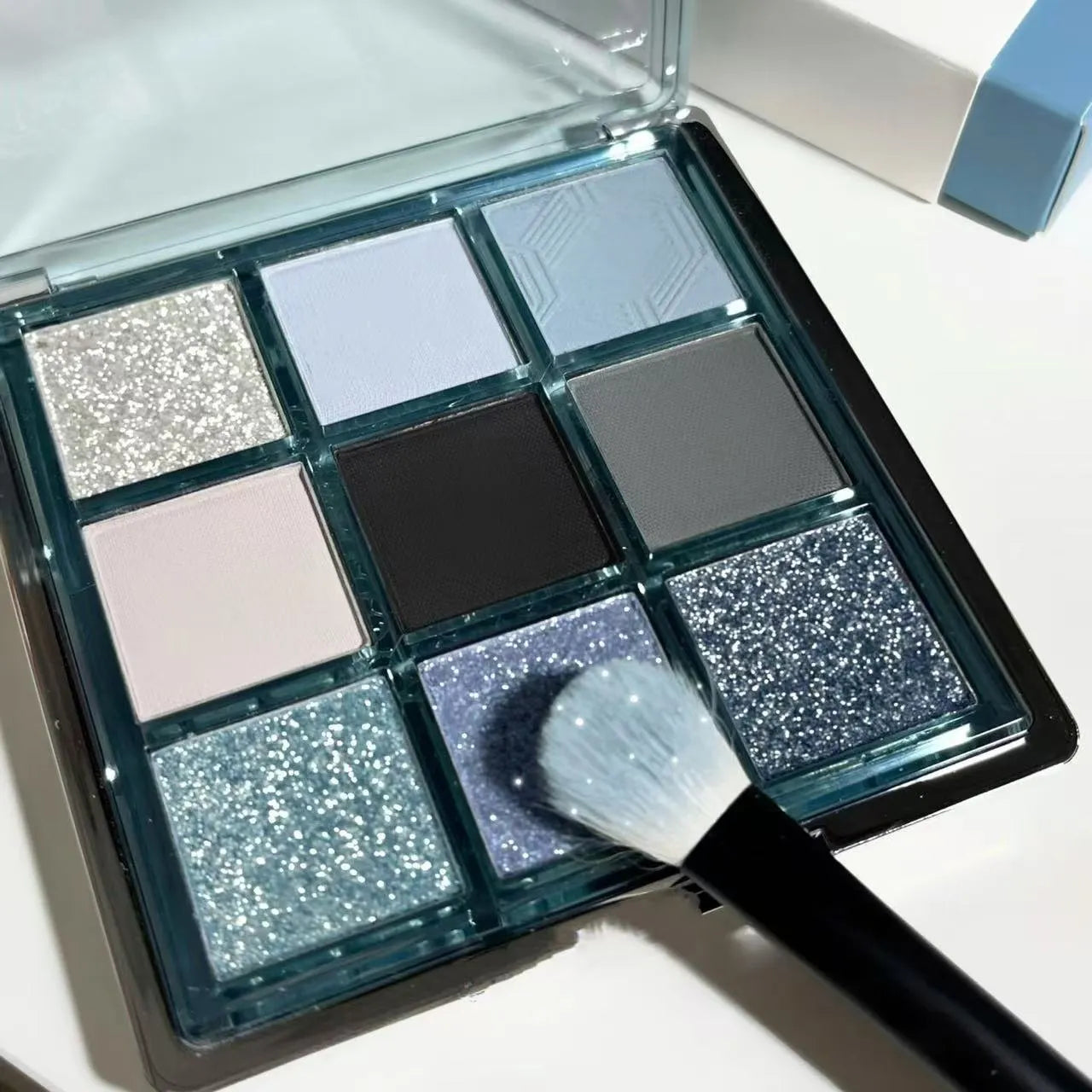 MUGELEEN nine-colour eye shadow palette 08 showing matte and shimmer blue smoked eye shadows