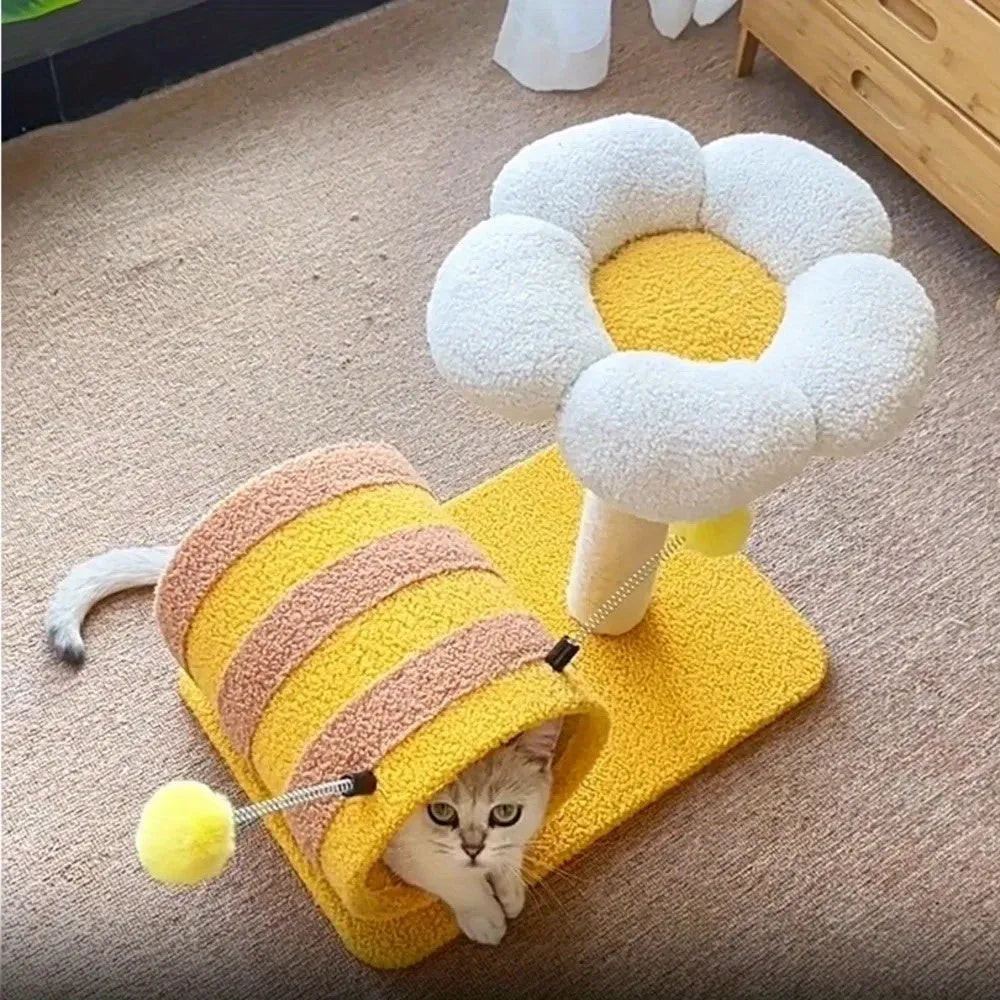 Yellow cat tree with sisal scratching posts and a fabric tunnel.