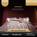 Silk four-piece quilt cover set in solid colour displayed on bed