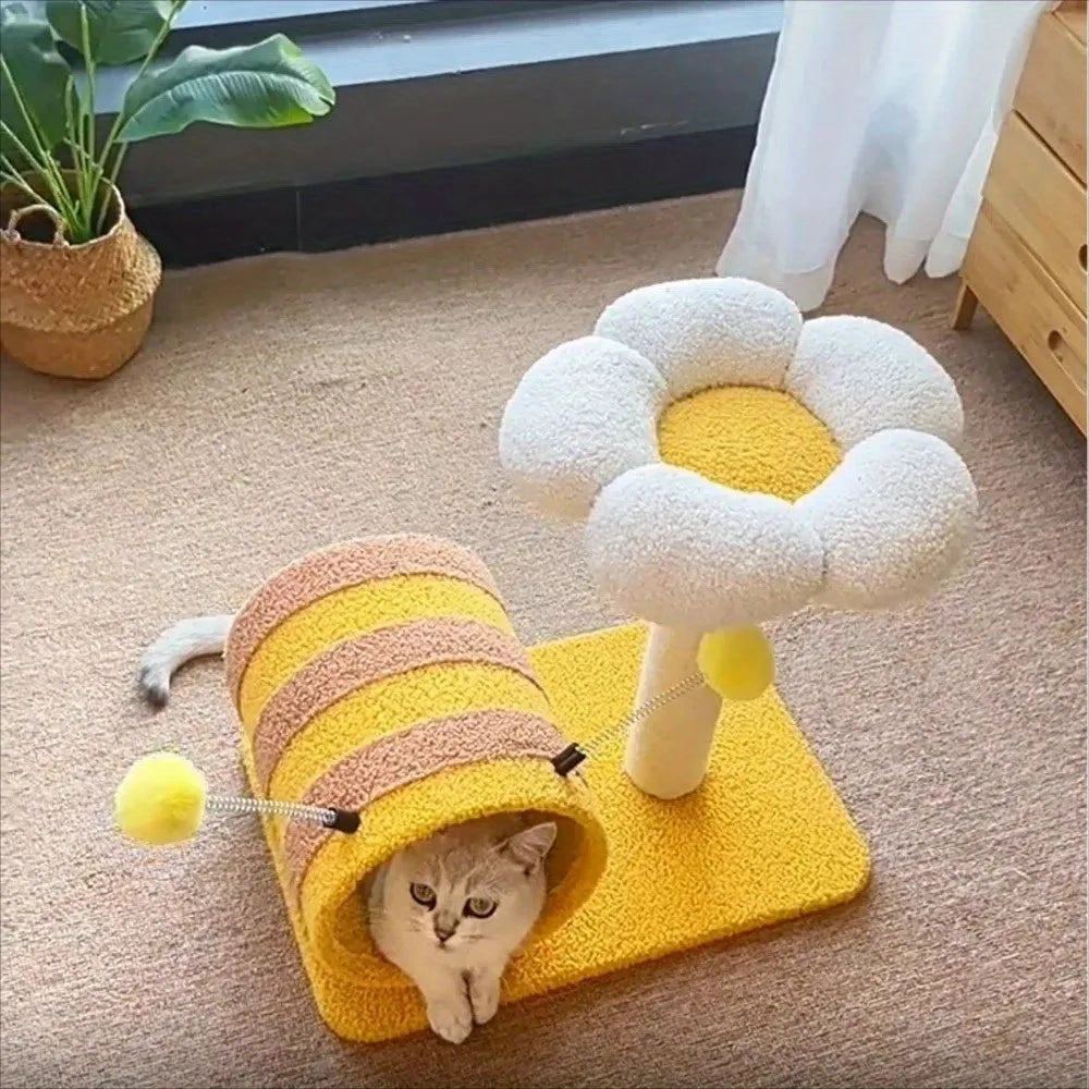 Yellow cat tree with sisal scratching posts and a fabric tunnel.