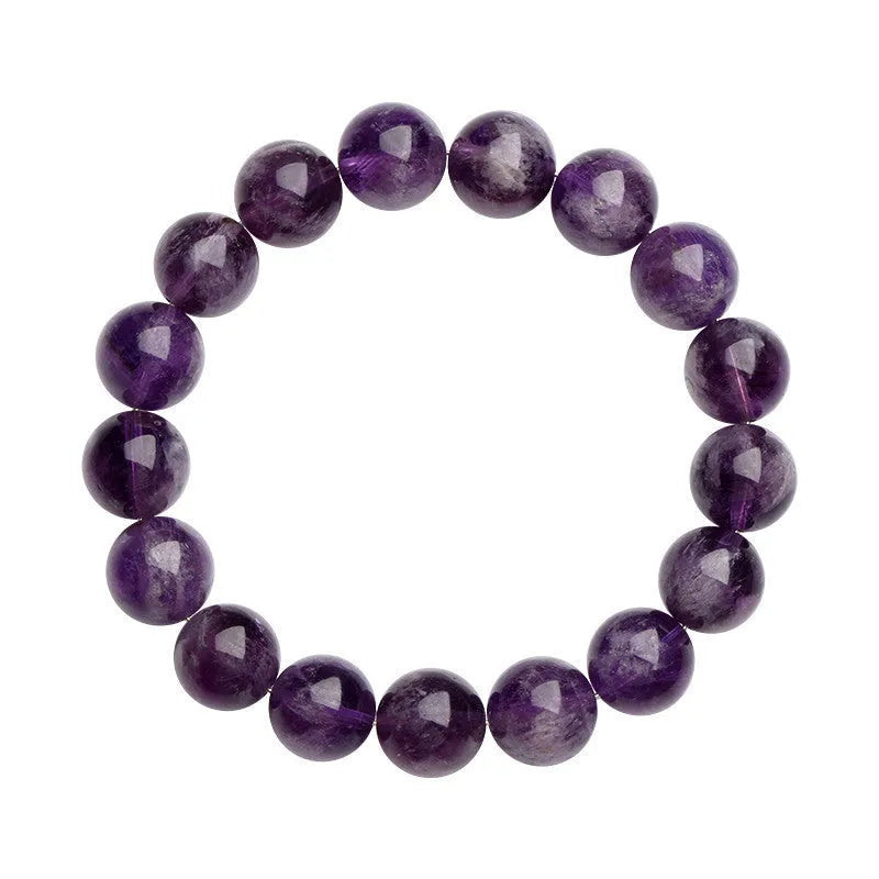 Natural Feather Amethyst Ruyi crystal bracelet with scattered geometry beads on a wrist.