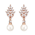 Geometric pearl earrings with micro inlaid zircon detailing and floral design in metallic plating