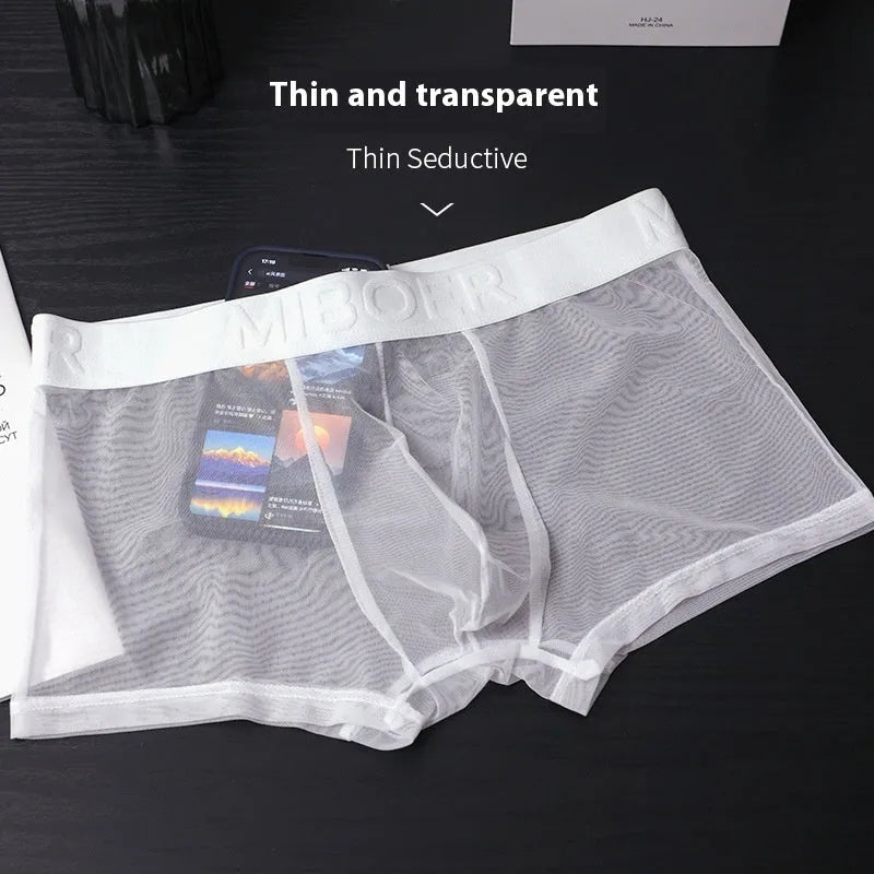 Men's thin invisible boxer shorts in black, white, sapphire blue, skin colour, green, and pink colours