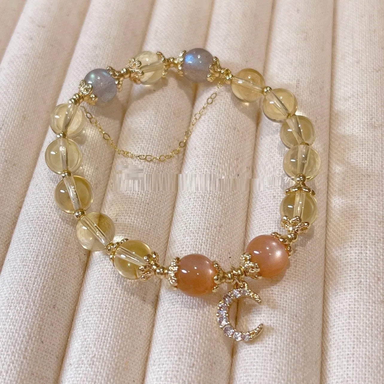 Citrine moonstone crystal bracelet with gold electroplated finish and diamond-shaped design