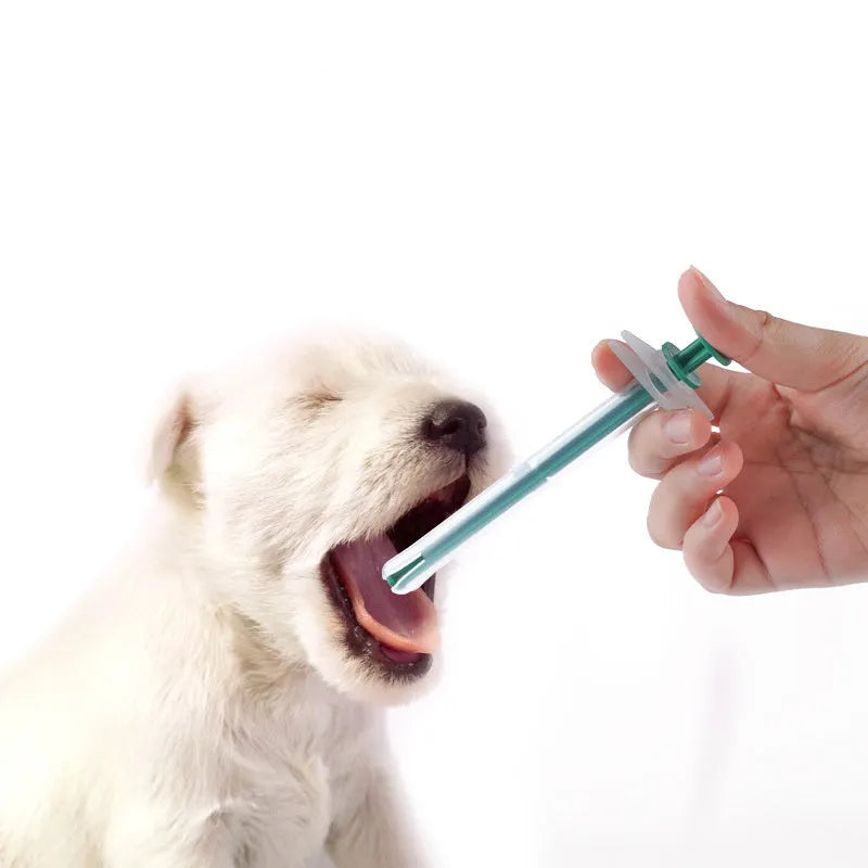 Two pet pill shooter syringes with soft silicone tips for administering medication to cats and dogs