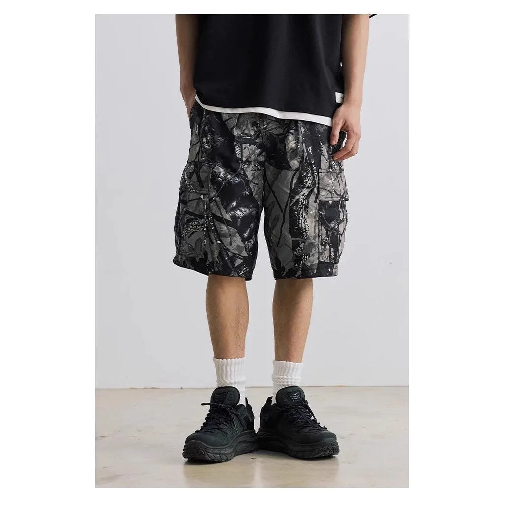 Loose fit straight-leg denim shorts on hanger, showing micro-elastic waistband and zip fly in army green colour.