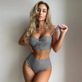 A rose red plaid bikini set showing the high-waisted swim briefs and matching top for women.