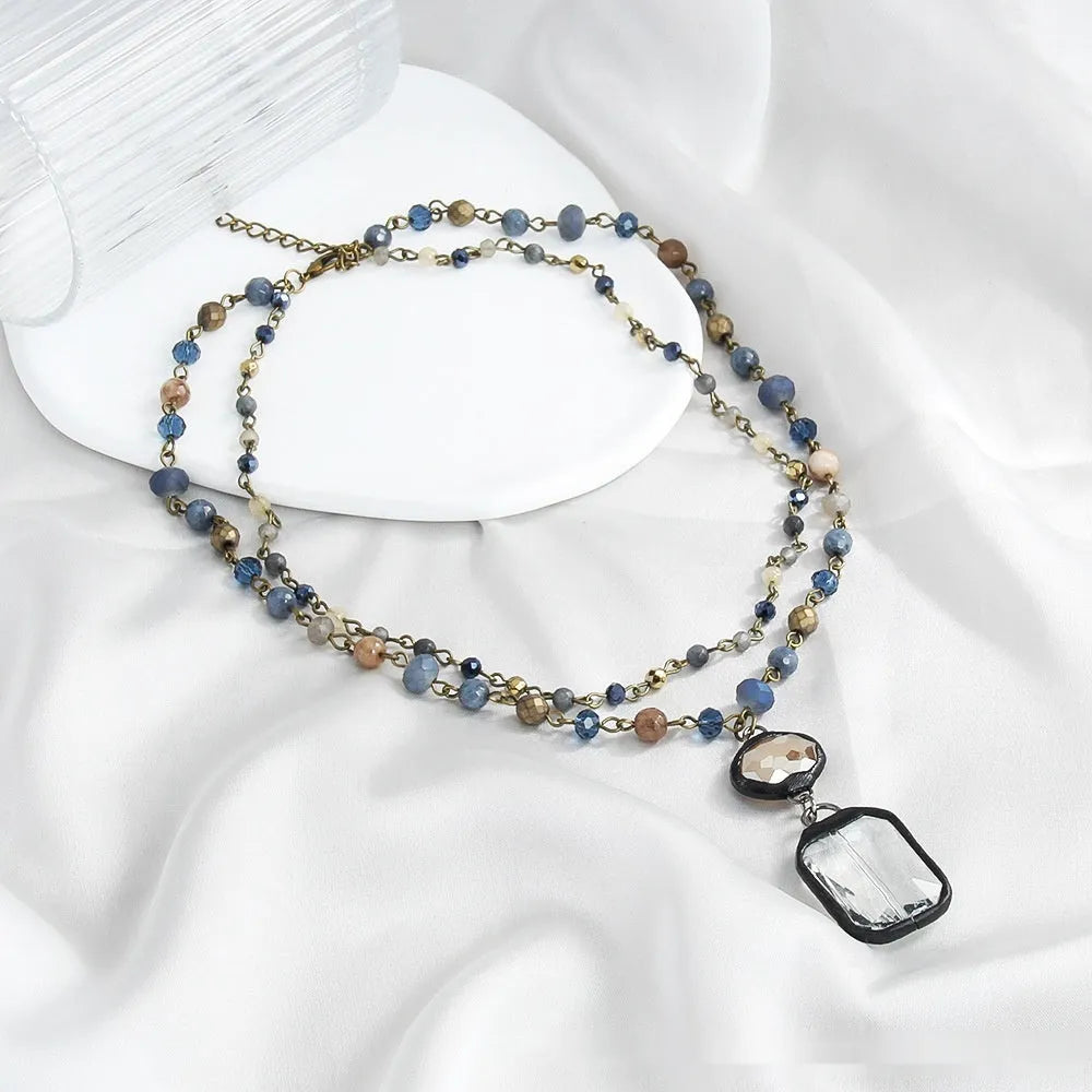 Tribal style two-layer necklace with natural stone and glass beads on alloy chain