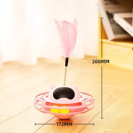 Pink cat tumbler turntable toy with self-hi feature for independent play