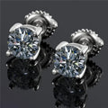 Screw-back moissanite stud earrings in sterling silver with geometric design and four-claw setting
