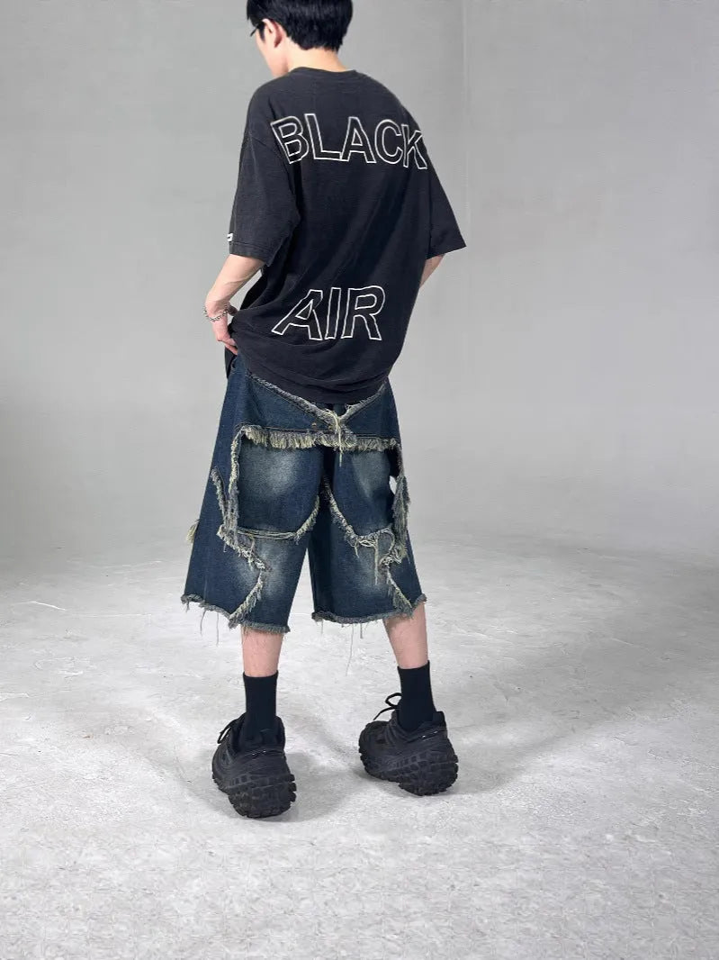 Men's blue retro denim shorts with frayed hem and five-pointed star design, loose fit with knee-length styling