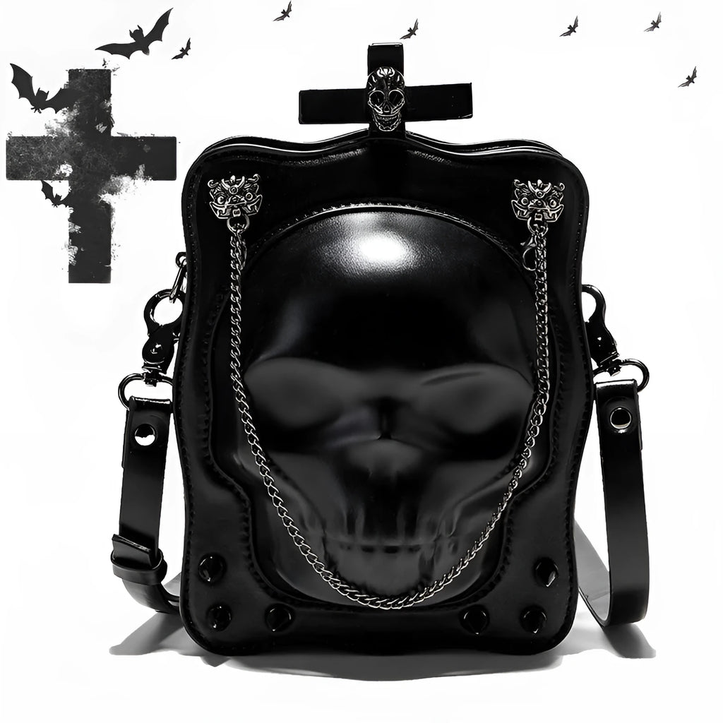 Black square crossbody bag with embossed skull design, chain accents, and zip opening