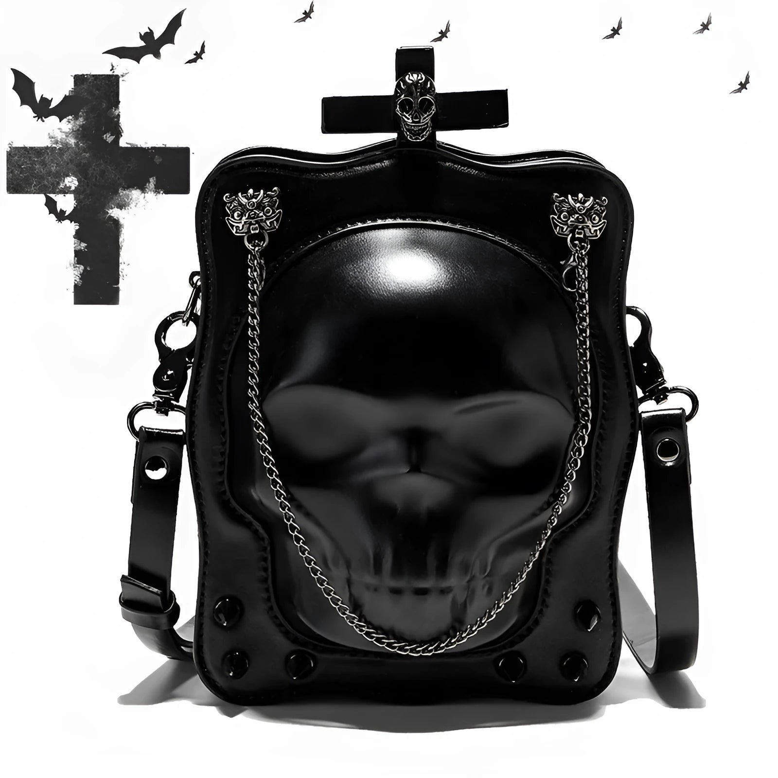 Black square crossbody bag with embossed skull design, chain accents, and zip opening