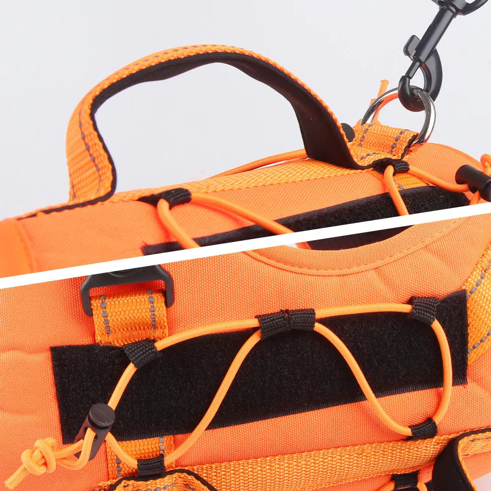Orange reflective dog vest harness with a black full-handle grip rope attached.