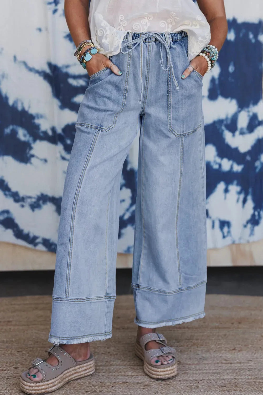 Beau blue women's wide leg denim trousers with drawstring waist and raw hem detail