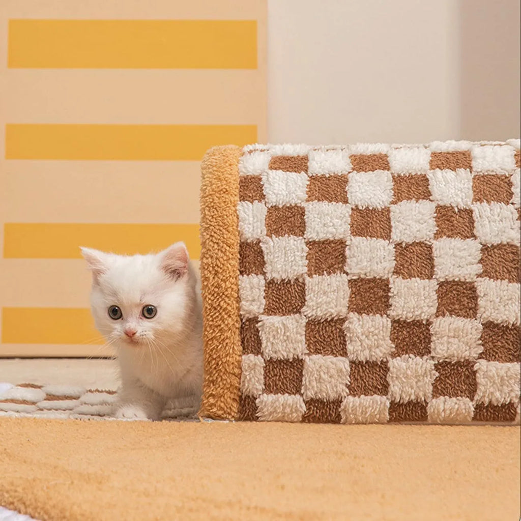 Fan-shaped plush pet bed with central play tunnel in plaid design, shown in coffee colour.