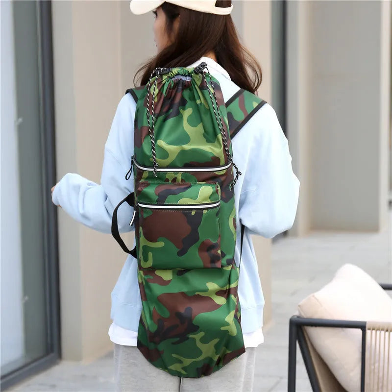 Black waterproof nylon skateboard bag with longboard fishing rod and flippers inside