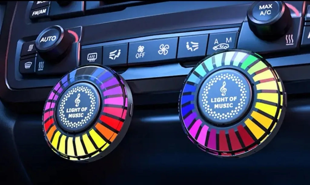 3D RGB car atmosphere light mounted on a car air vent, showing voice control and aromatherapy functions.