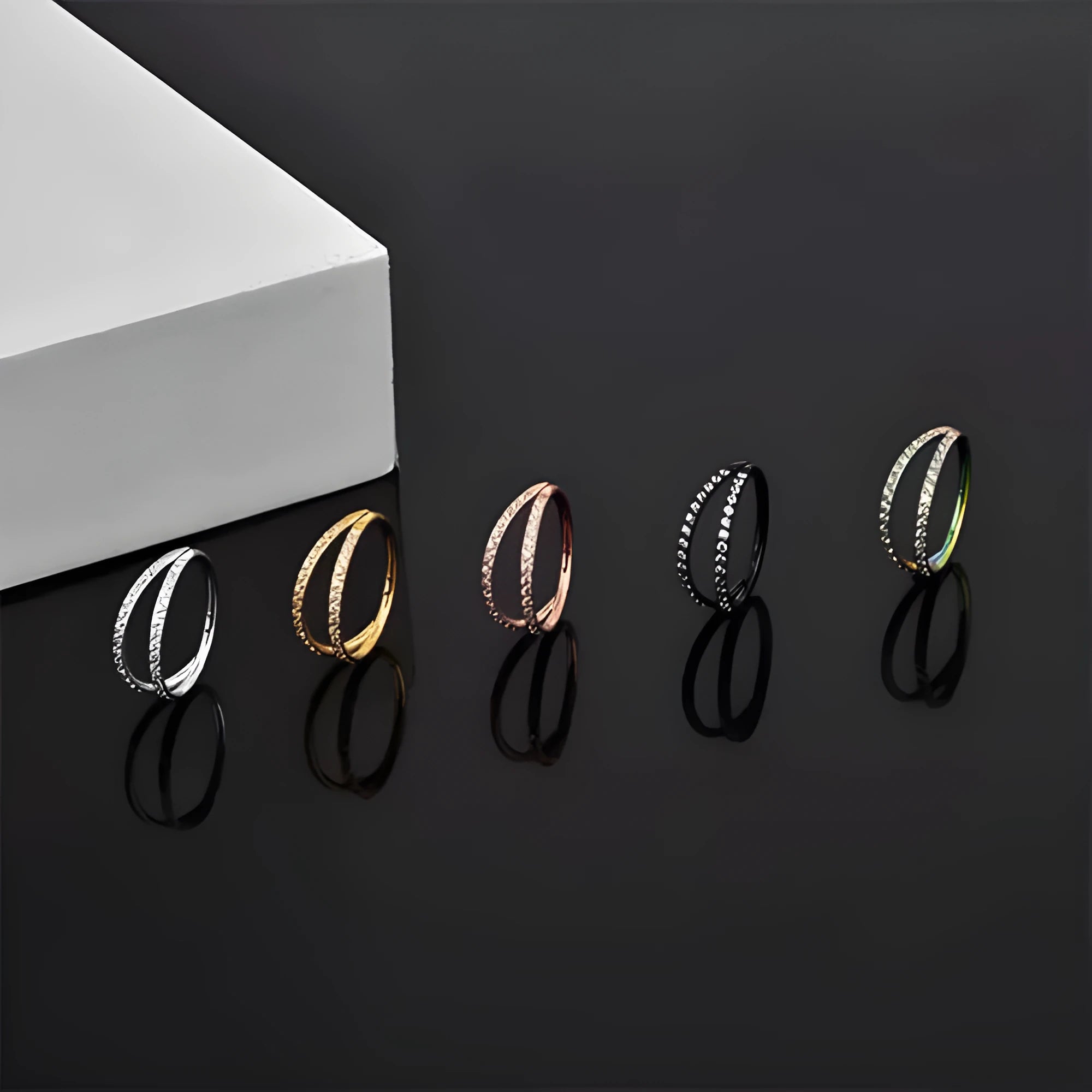G23 titanium alloy lip and nose ring in gold or steel colour with diamond treatment, showing gauge and length sizes.