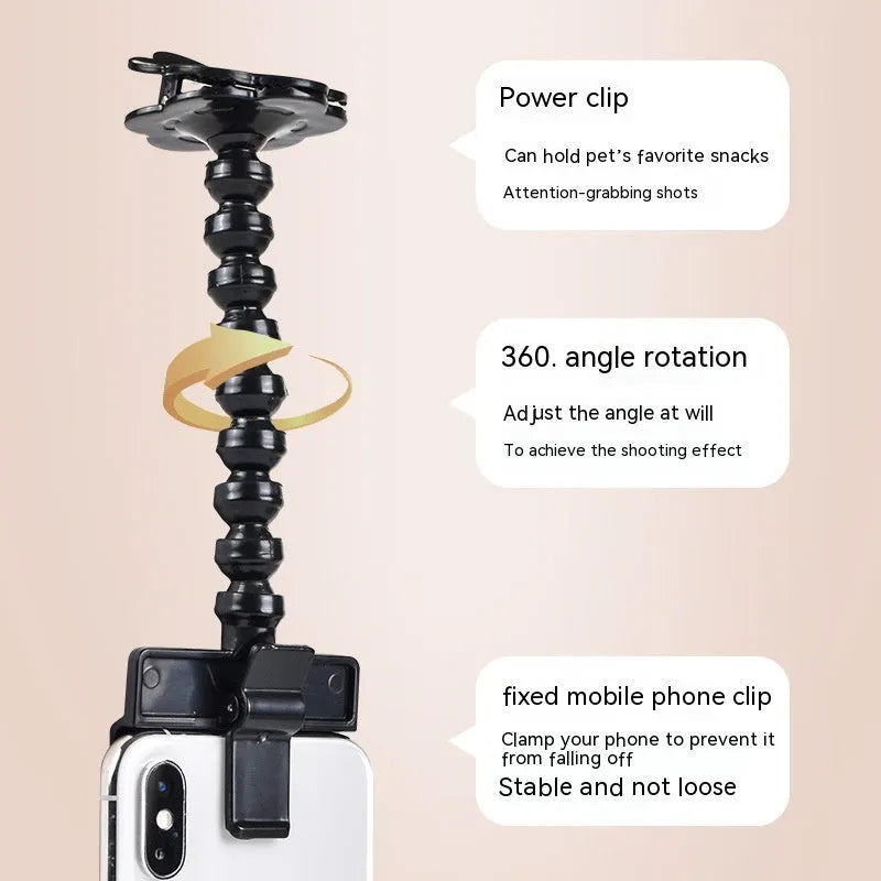 Black pet photography tool with a clip for holding treats and a phone holder on a rotating support