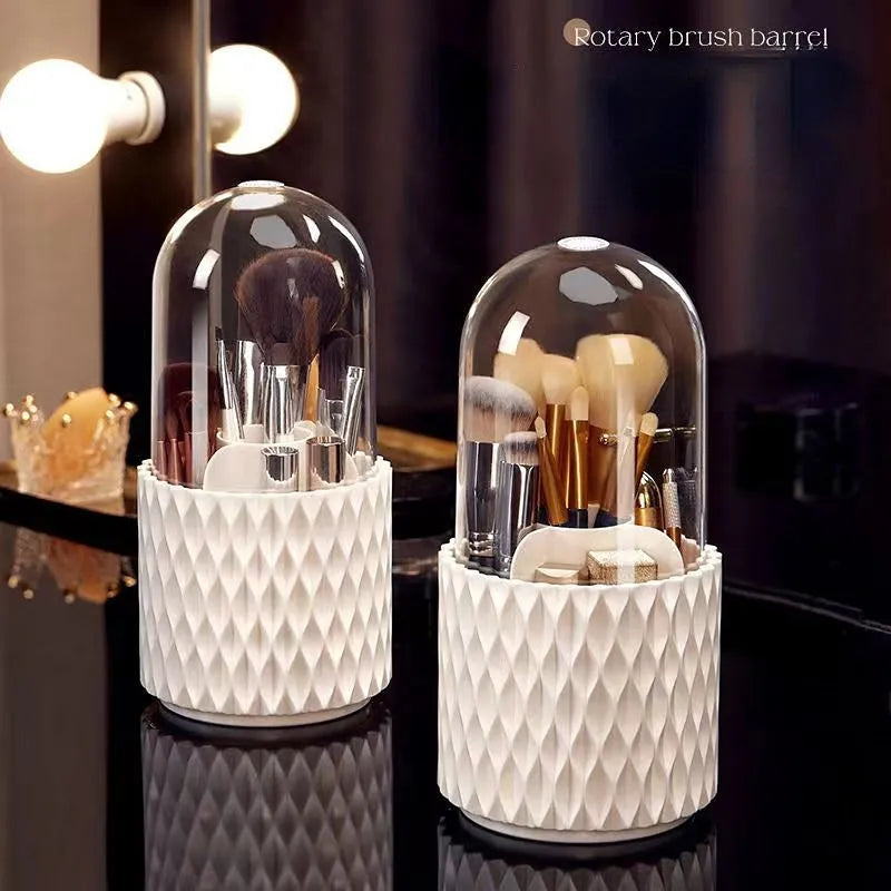 White rotating transparent makeup brush storage box with lid on desktop
