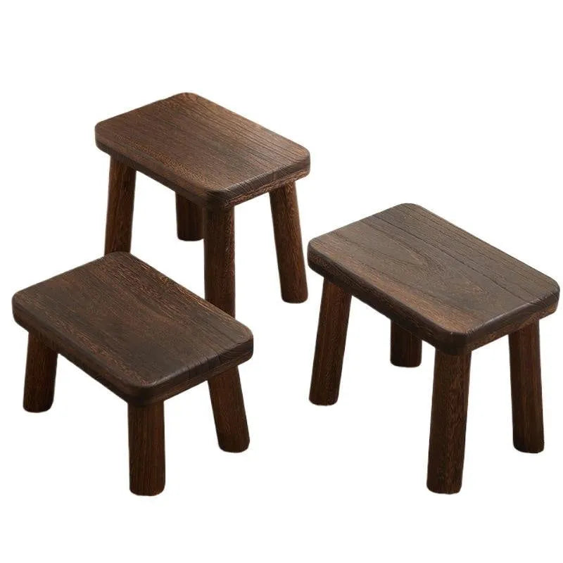 Distressed brown wooden stool with bracket legs for changing shoes