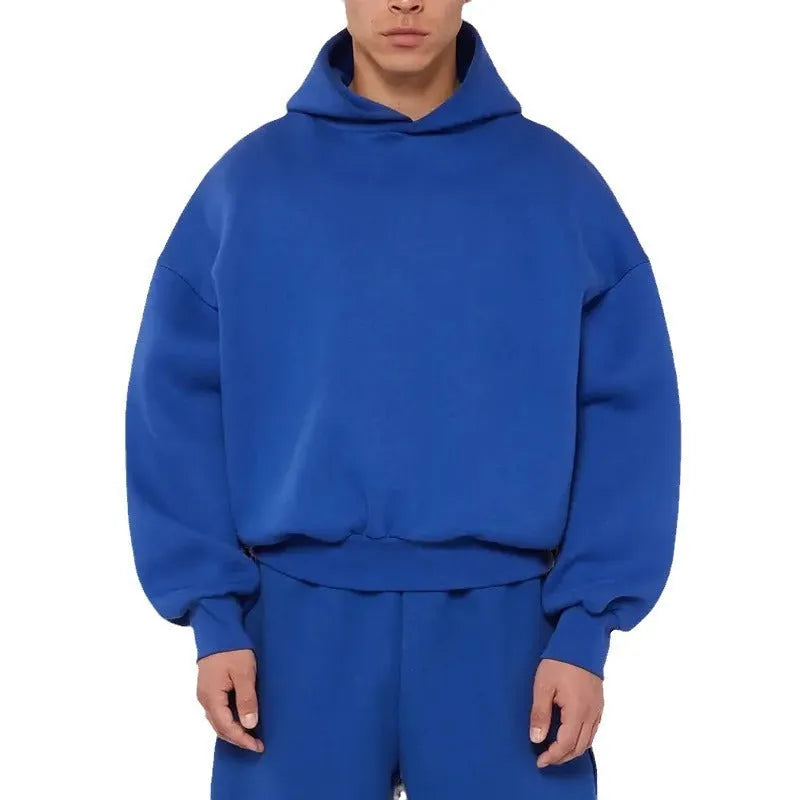 A man's grey fleece-lined cotton hoodie with a pullover design and threaded long sleeves.