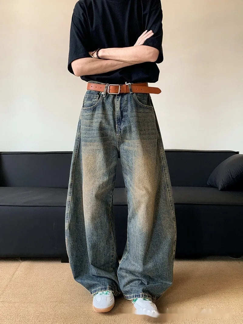 Men's retro blue distressed wide-leg denim trousers with machete styling detail